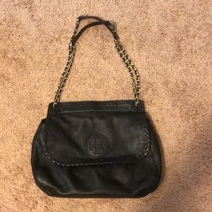 Black leather Tory Burch purse with gold chain.